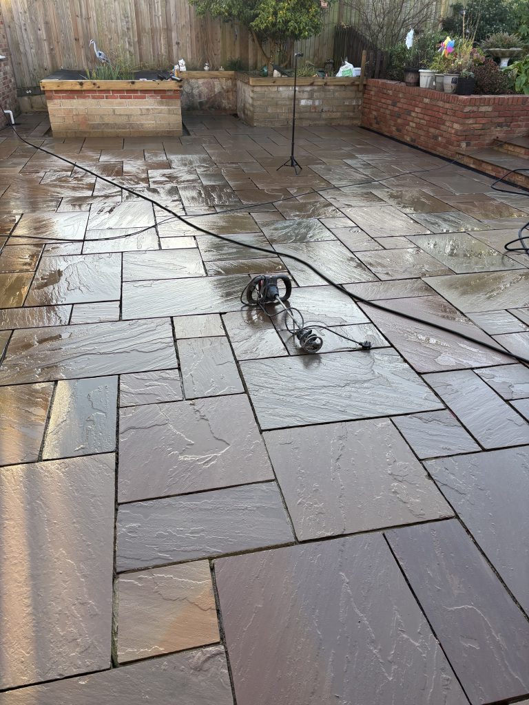 Inian sandstone paving installed and ready to grout in the rain with GftK vdw 850